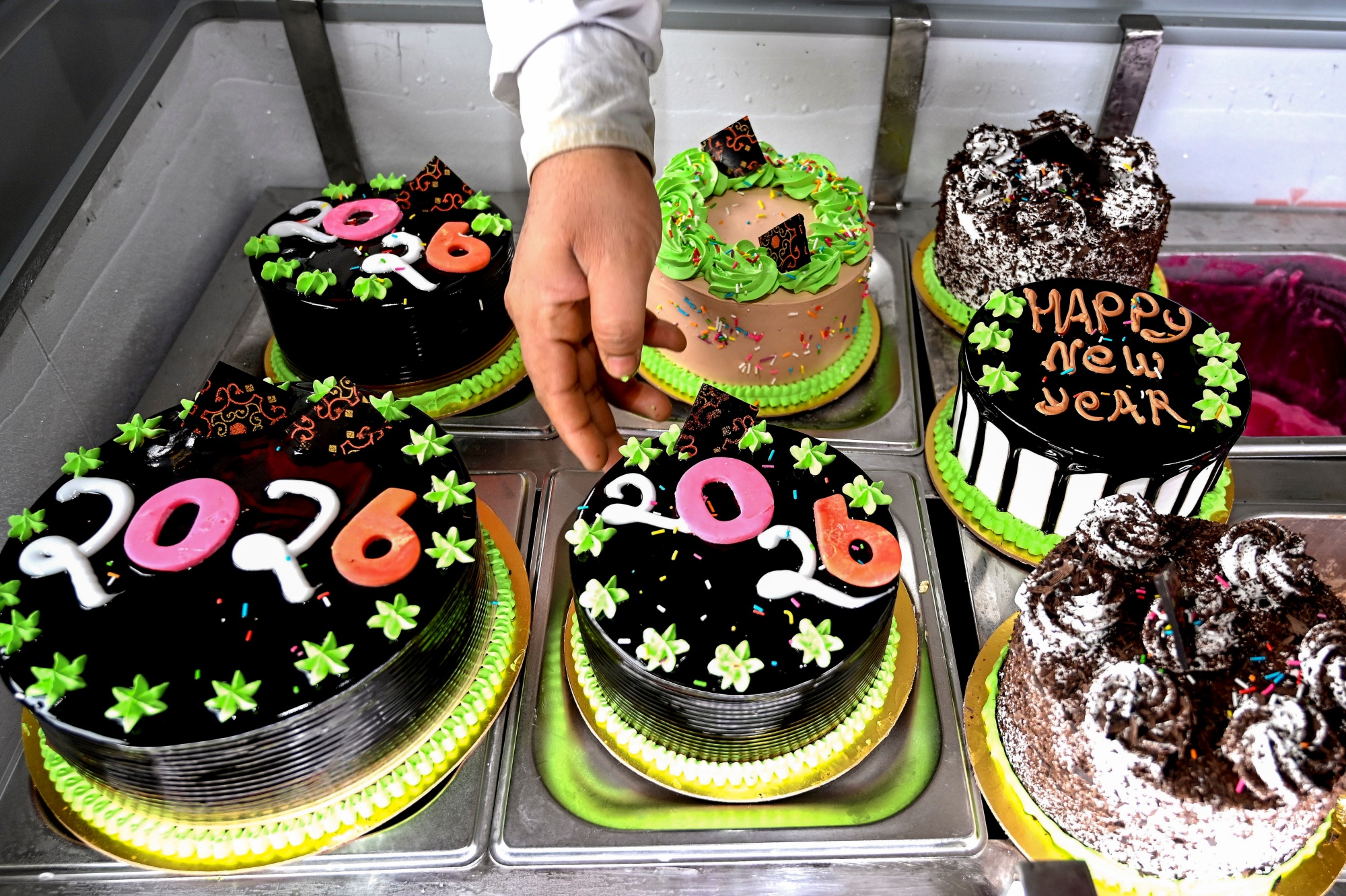 A bakery displays '2026' cakes on the New Year's eve, in Bikaner
