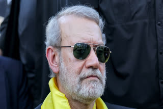 Iran's security chief Ali Larijani attends a ceremony by the Lebanese Shiite movement Hezbollah marking the first anniversary of Israel's assassination of their longtime leader Hassan Nasrallah, in Beirut's southern suburbs on September 27, 2025.