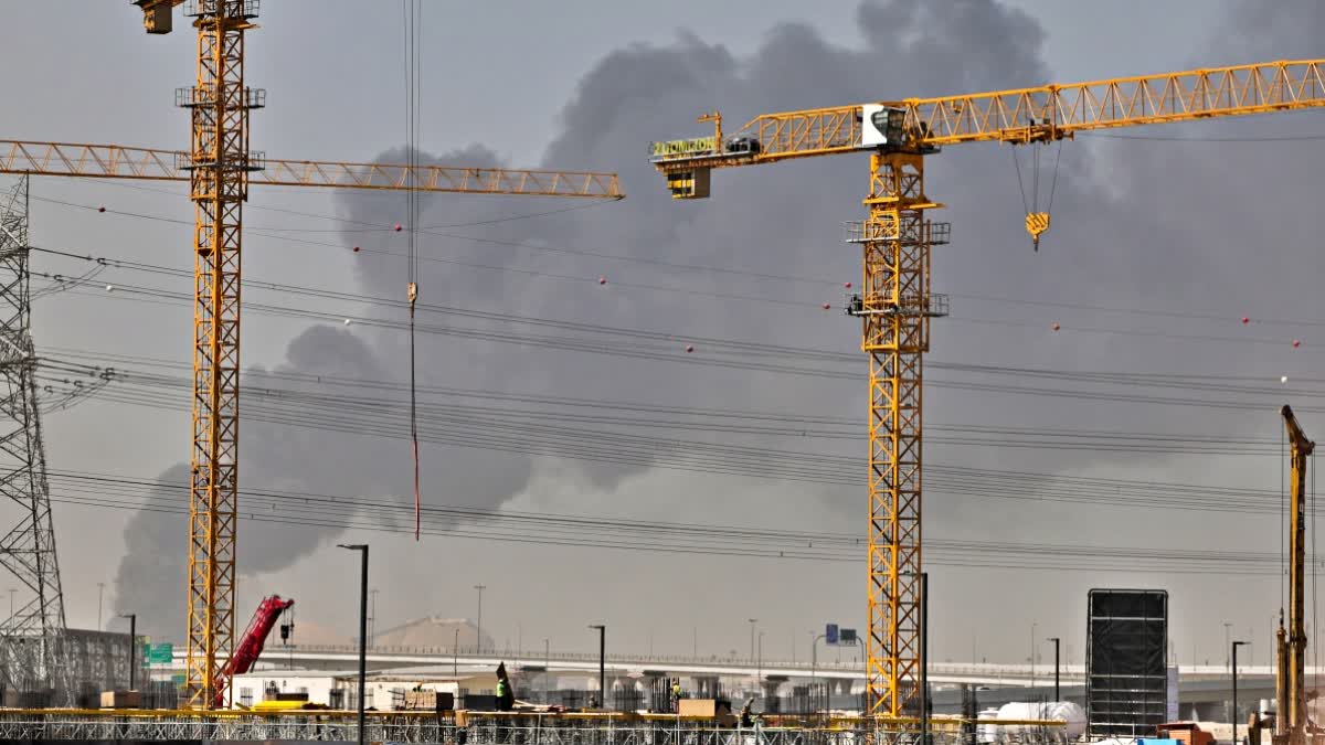 A plume of smoke rises from the port of Jebel Ali following a reported Iranian strike in Dubai on March 1, 2026. (AFP)