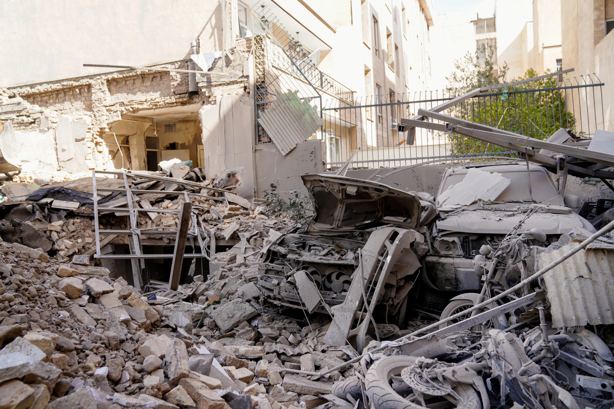 Rubble remains in the aftermath of an Israeli-US strike in Tehran on Saturday