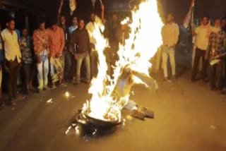 Protesters burn a tyre on the Lebukhali Road in Hasnabad.