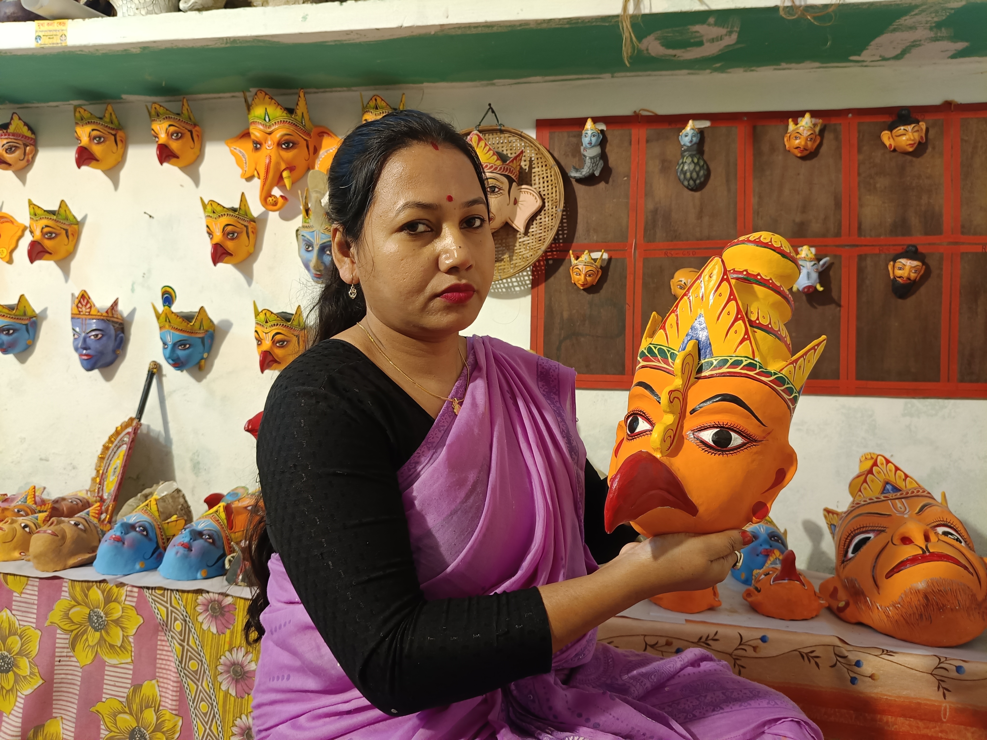 Juri Moni Kalita from Bengenaati Satra in Majuli achieved self-reliance by mask-making