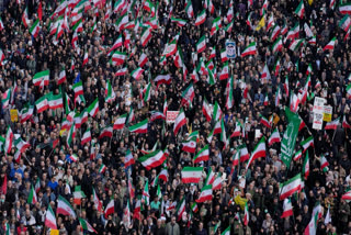 Mourners gather during a funeral procession in Tehran, Iran, Wednesday, April 1, 2026, for Alireza Tangsiri, the head of Iran's Islamic Revolutionary Guard Corps Navy, and others killed in Israeli strikes in late March.