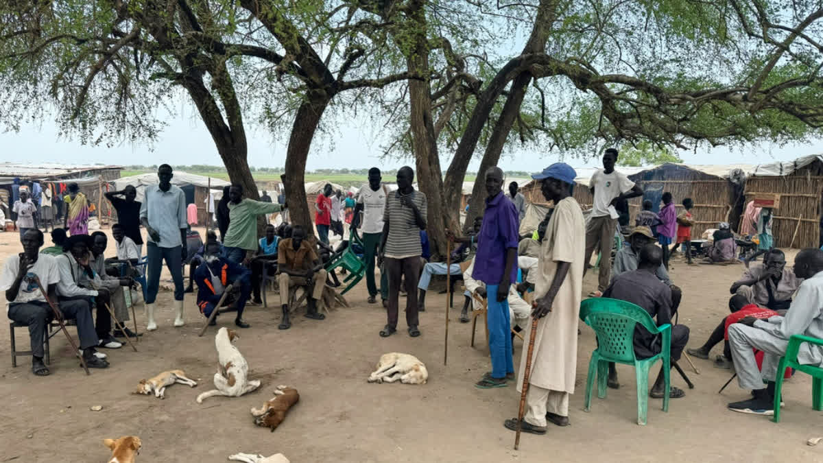 Community leaders gather under a tree near a market in Chuil, Nyirol County, Jonglei State, South Sudan, Friday, April 10, 2026.