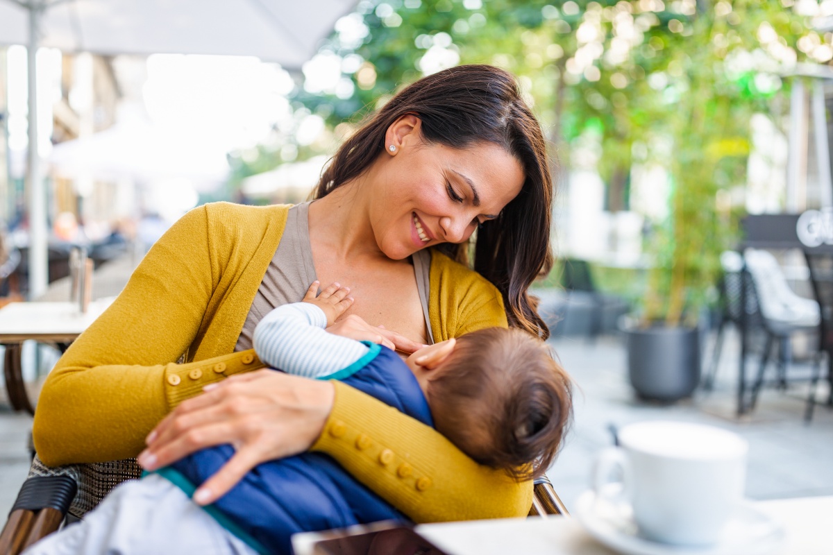 Woman breastfeeding at a coffee shop