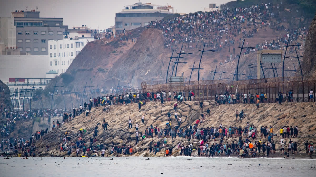 Migrants return to Morocco from the Spanish enclave of Ceuta, Friday, July 31, 2026.