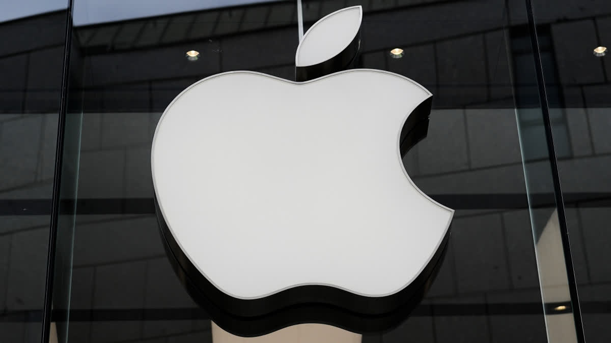 FILE - The Apple logo is illuminated at a store in Munich, Germany, April 2, 2026.