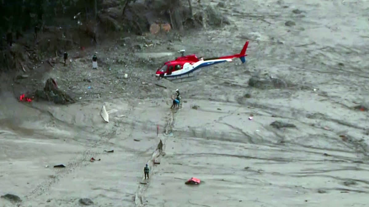 Nepal Army uses a helicopter for rescue operation in the flash flood-ravaged areas in Rasuwa