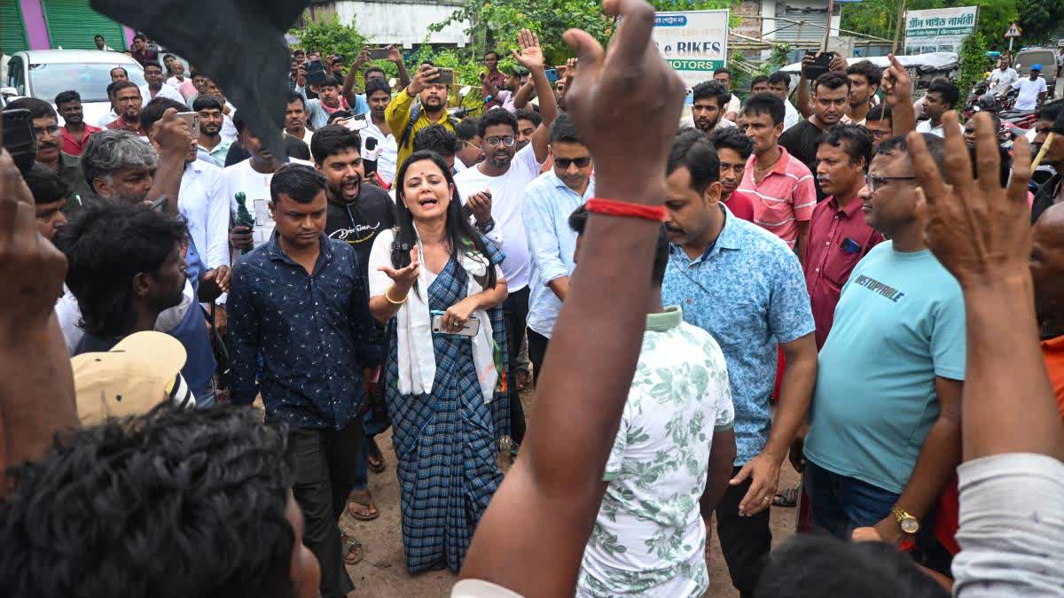 Protestors show black flags to Mahua Moitra in Chapra on Tuesday.