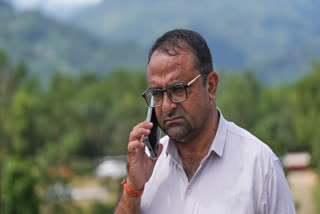 Rajendra Dawadi, a school teacher of Tribhuvan Trishuli Secondary School, talks on his mobile phone in Trishuli Valley in Nepal's Nuwakot district, Monday, Aug. 31, 2026.
