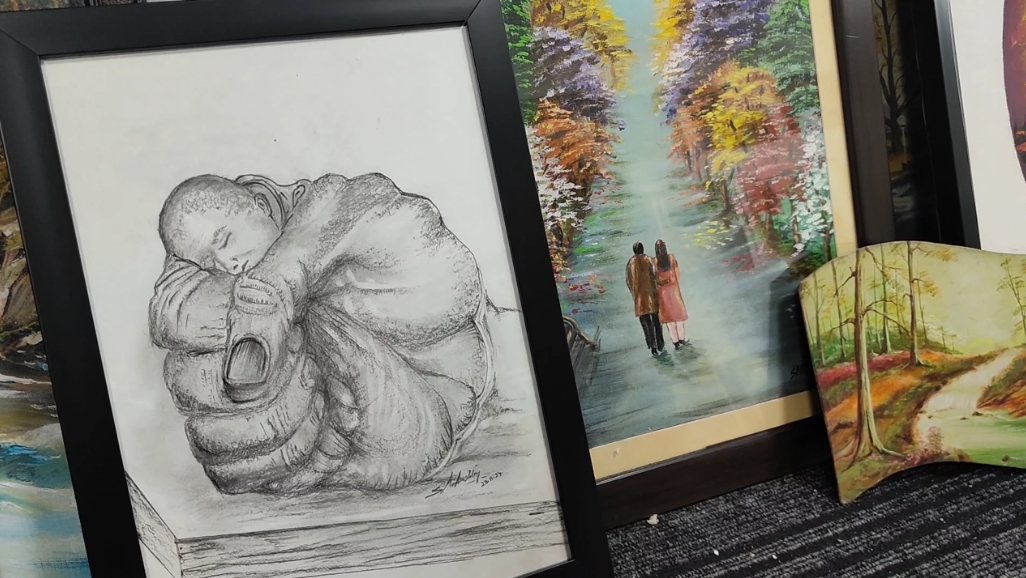 Paintings on display at painter SM Mushtaq's art gallery in Srinagar