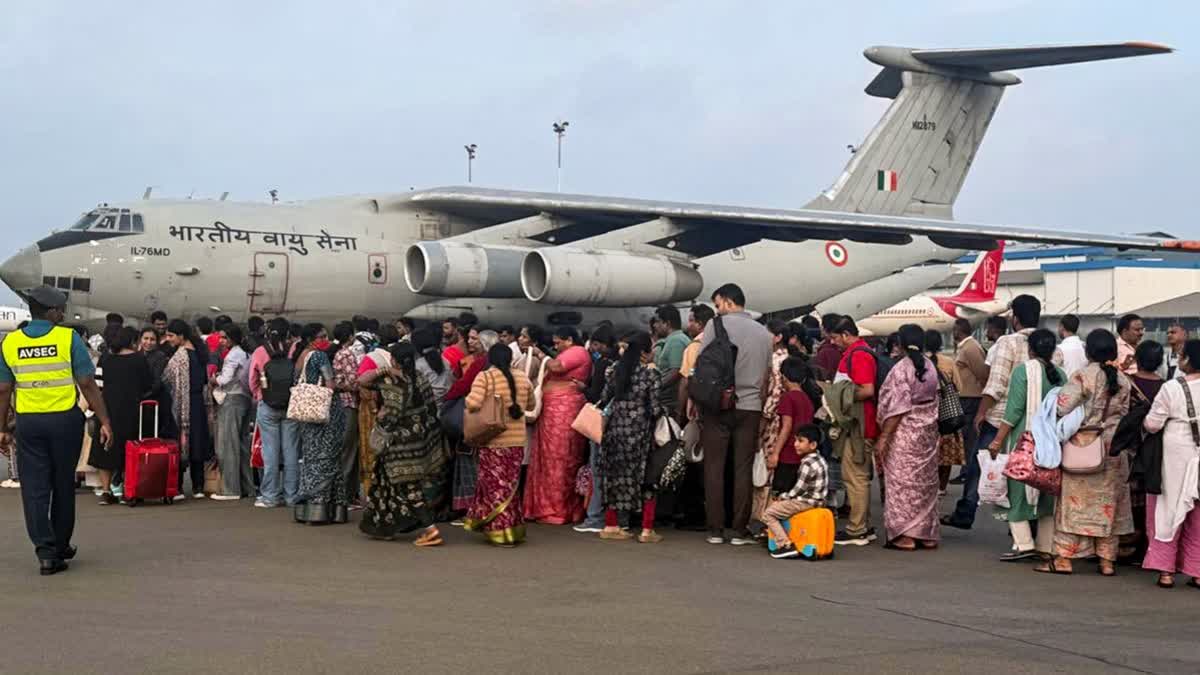 this image posted on Nov. 30, 2025, Indian nationals stranded in cyclone-hit Sri Lanka being evacuated by the Indian Air Force (IAF)