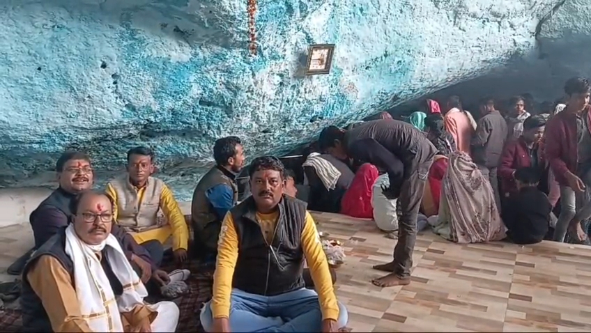 Devotees sitting after darshan in the temple premises
