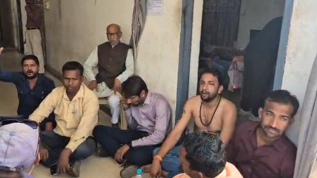 Former district member protest half naked