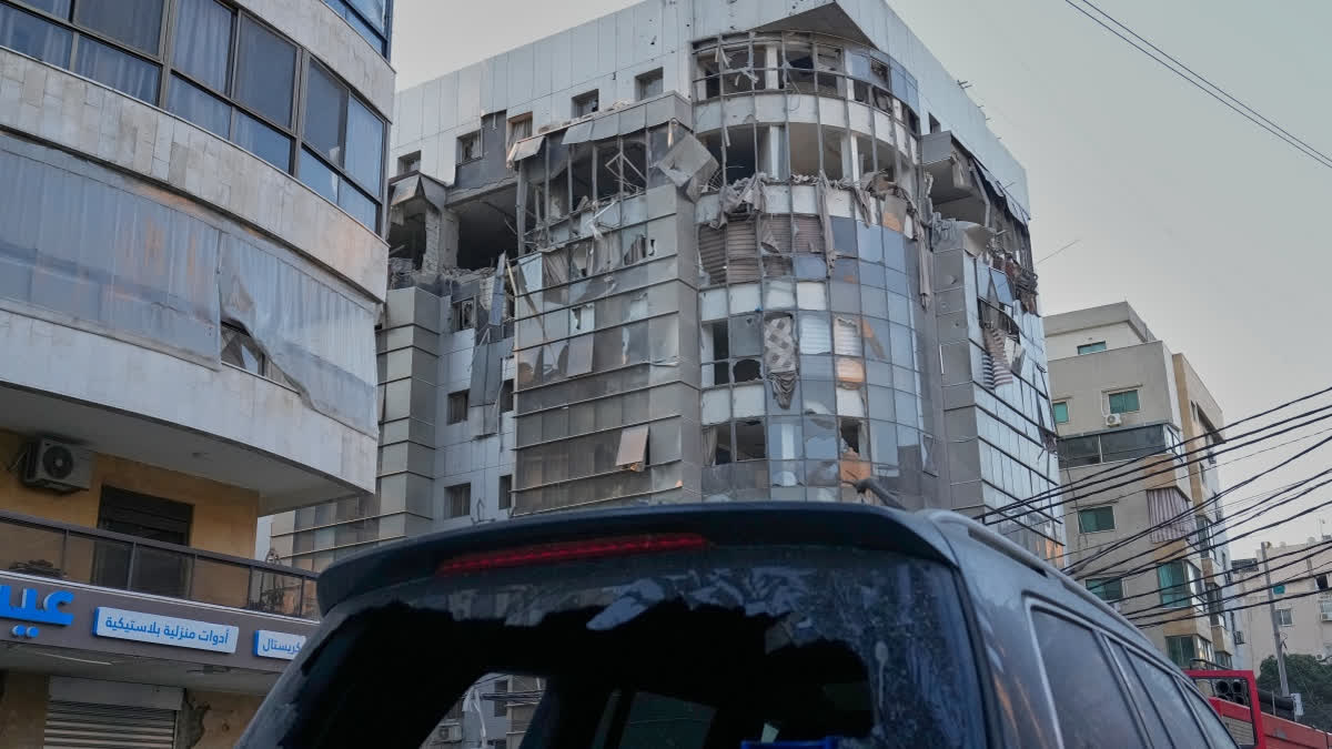 A damaged car is parked in front of an apartment building that was hit in an Israeli airstrike in Dahiyeh, Beirut's southern suburb, Lebanon, Monday, March 2, 2026.