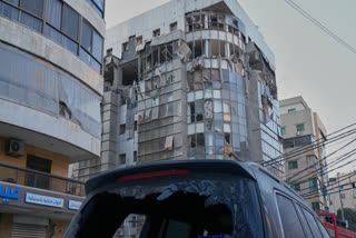 A damaged car is parked in front of an apartment building that was hit in an Israeli airstrike in Dahiyeh, Beirut's southern suburb, Lebanon, Monday, March 2, 2026.