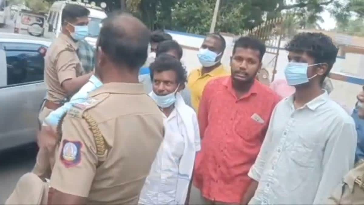 The arrested persons with the police.