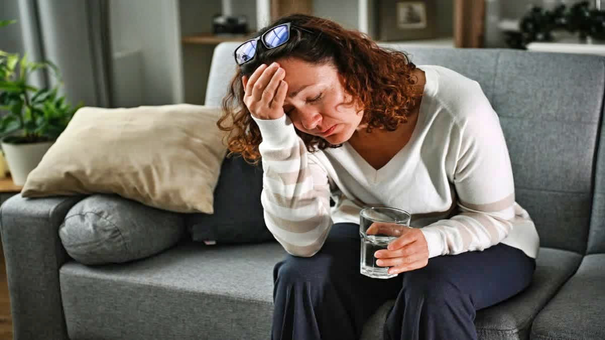 Woman feeling giddy in the heatwave