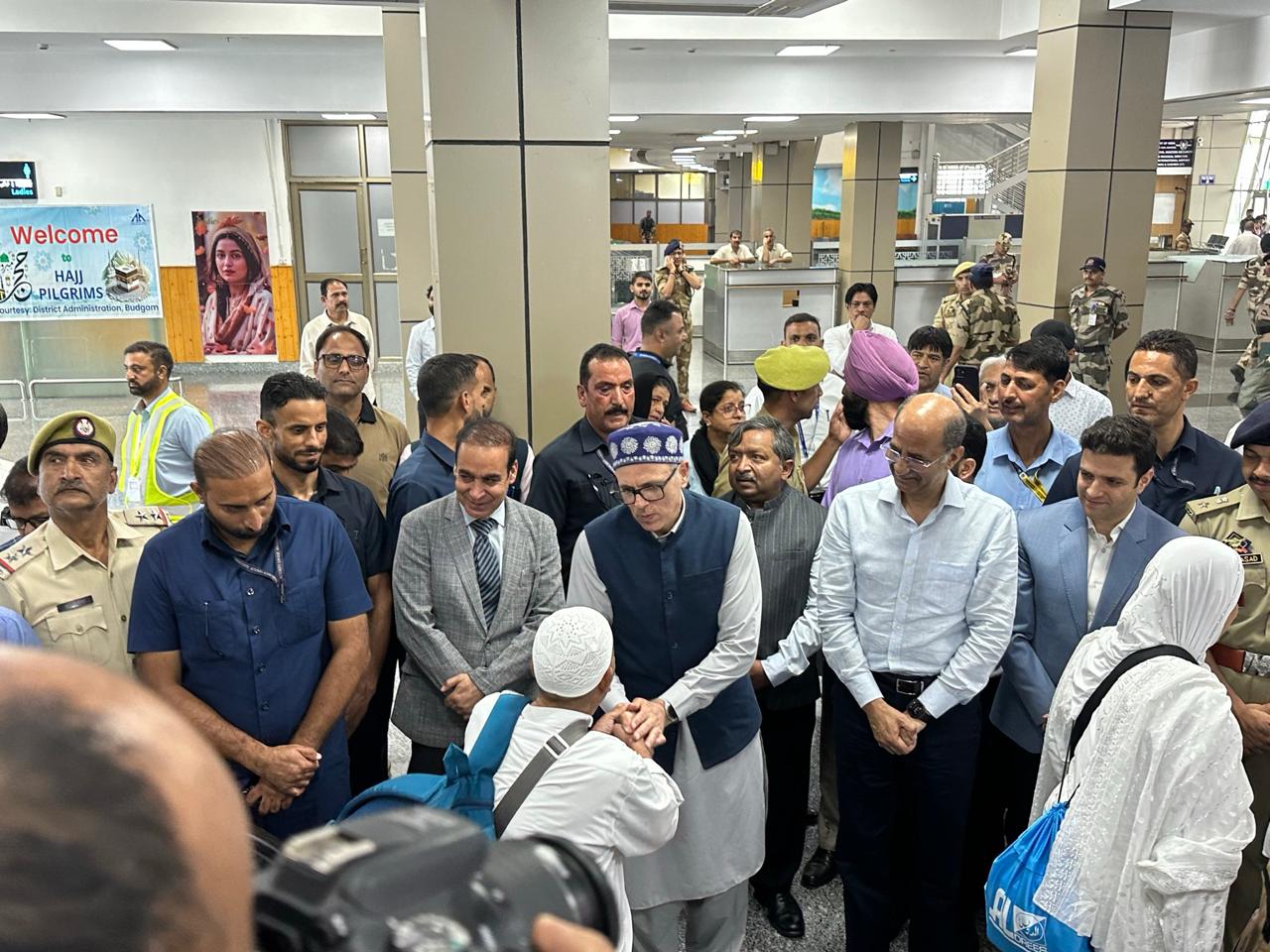 Jammu Kashmir CM Omar Abdullah greets pilgrims on their return from Hajj 2026, at Srinagar airport