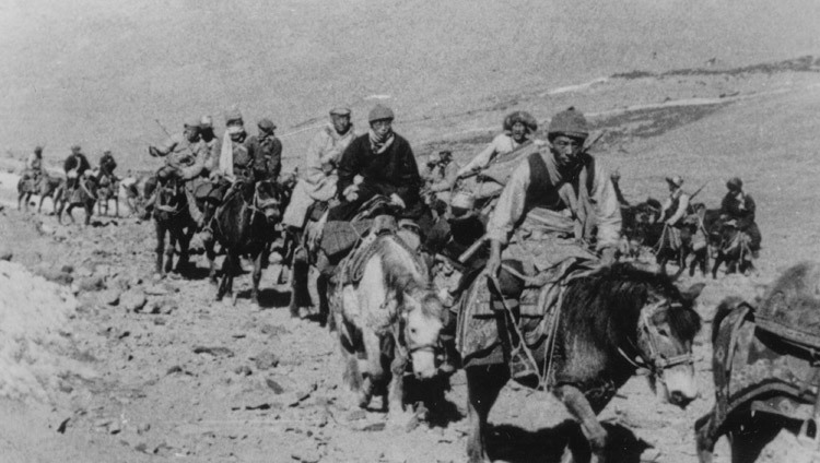 The 14th Dalai Lama fleeing Tibet into exile with Khampa (men from the Eastern province of Kham) bodyguards in March, 1959.