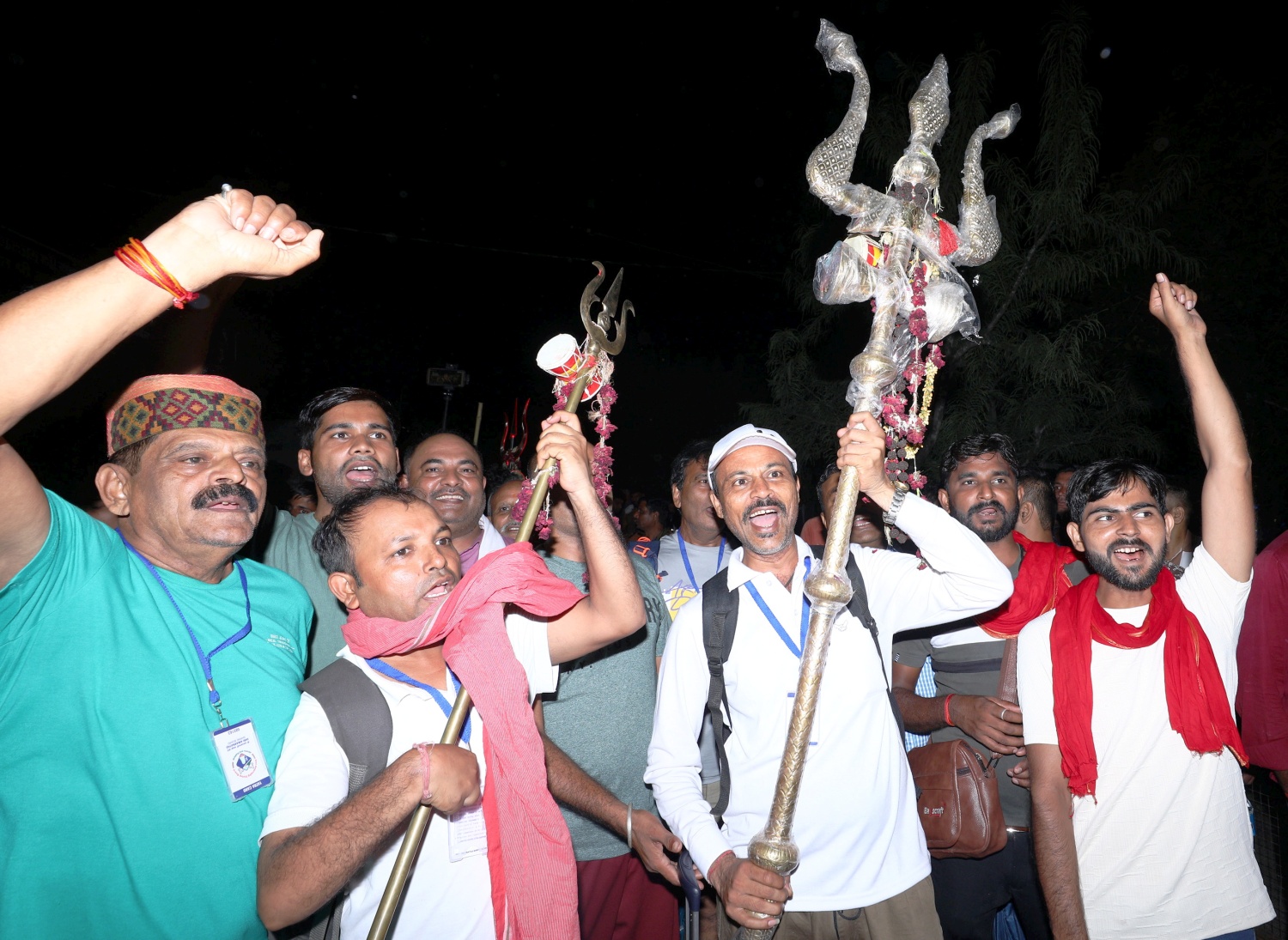 People raise religious slogans as the first batch of Amarnath Yatra pilgrims leave from Bhagwati Nagar Yatri Niwas base camp, in Jammu on Thursday.