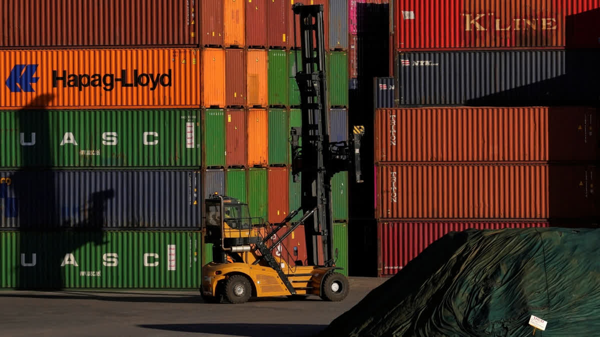 Leather, Textiles, Shrimp Exports to Hit Hard From 25 Pc US Tariff, Say Experts A heavy machine drives past shipping containers stacked at a depo, in Johannesburg, South Africa, Friday, Aug. 1, 2025.