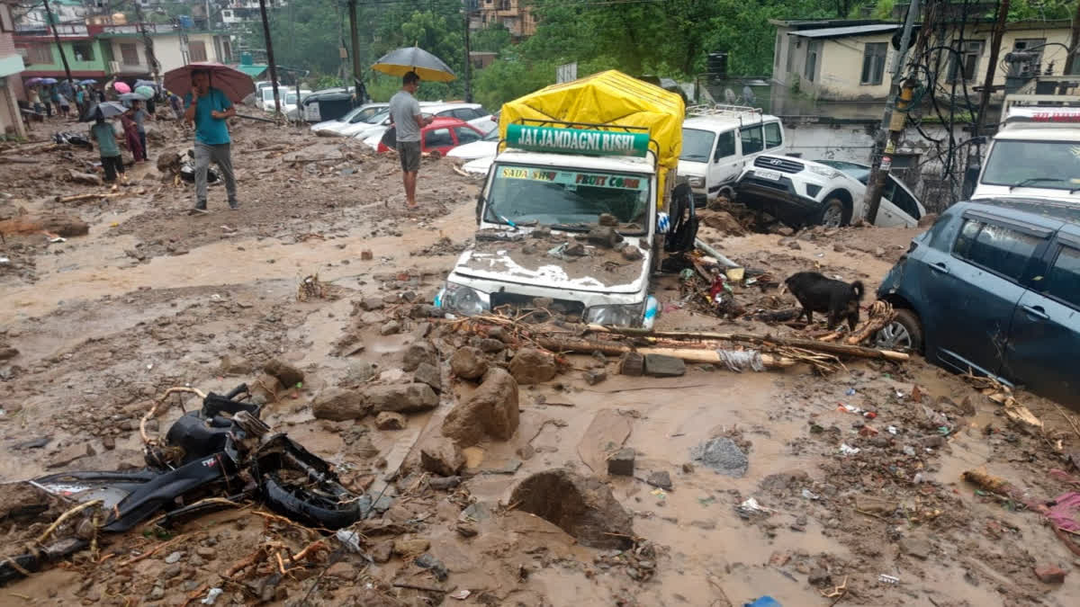 Vehicles stuck in the debris following flash floods triggered by heavy rainfall, in Mandi, Himachal Pradesh, Tuesday, July 29, 2025.