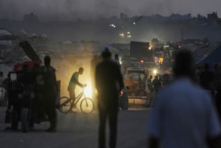 Displaced Palestinians fleeing northern Gaza Strip move with their belongings along the Sea Road, in Gaza City, Monday, Sept. 1, 2025.