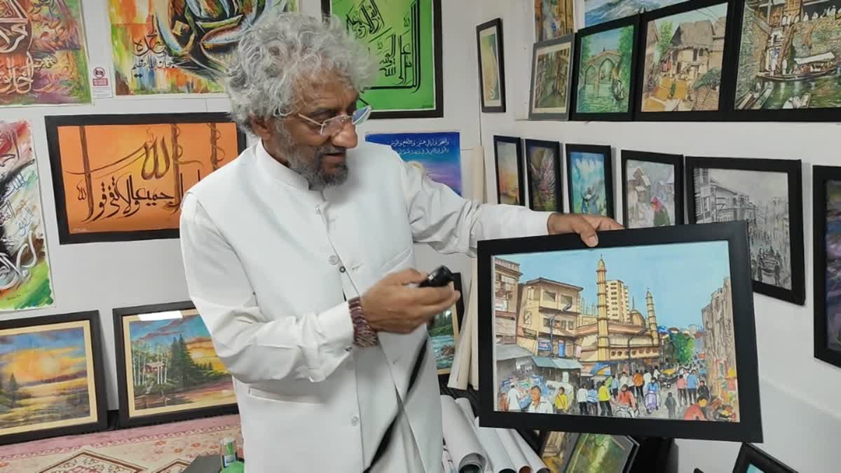 Painter SM Mushtaq shows a portrait at his art gallery in Srinagar, Jammu and Kashmir