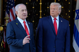 President Donald Trump listens as Israel's Prime Minister Benjamin Netanyahu speaks at Mar-a-Lago club in Palm Beach in 2025.