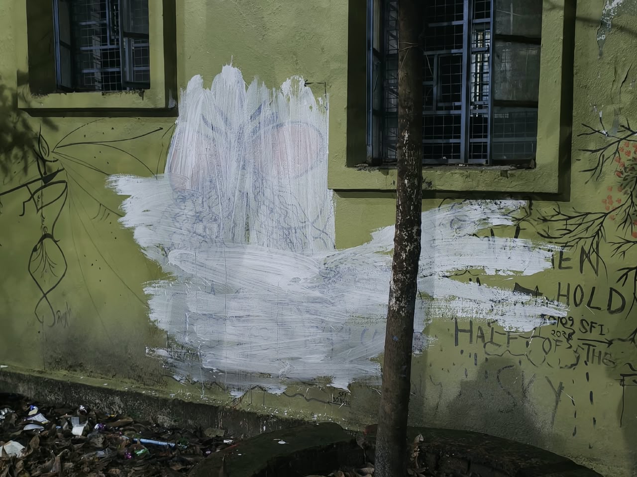 A fresh coat of paint on a graffiti at Jadavpur University.