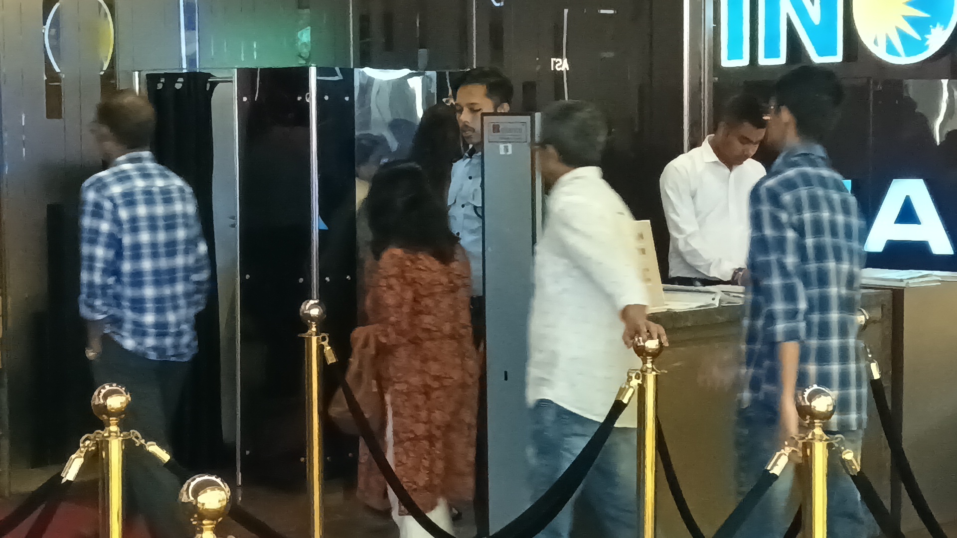 Viewers enter a multiplex in Kolkata to watch Roi Roi Binale.