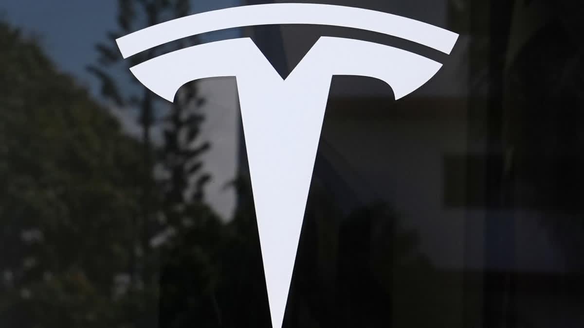 FILE - The Tesla logo is displayed at a Tesla dealership Thursday, Mar. 13, 2025, in Miami.