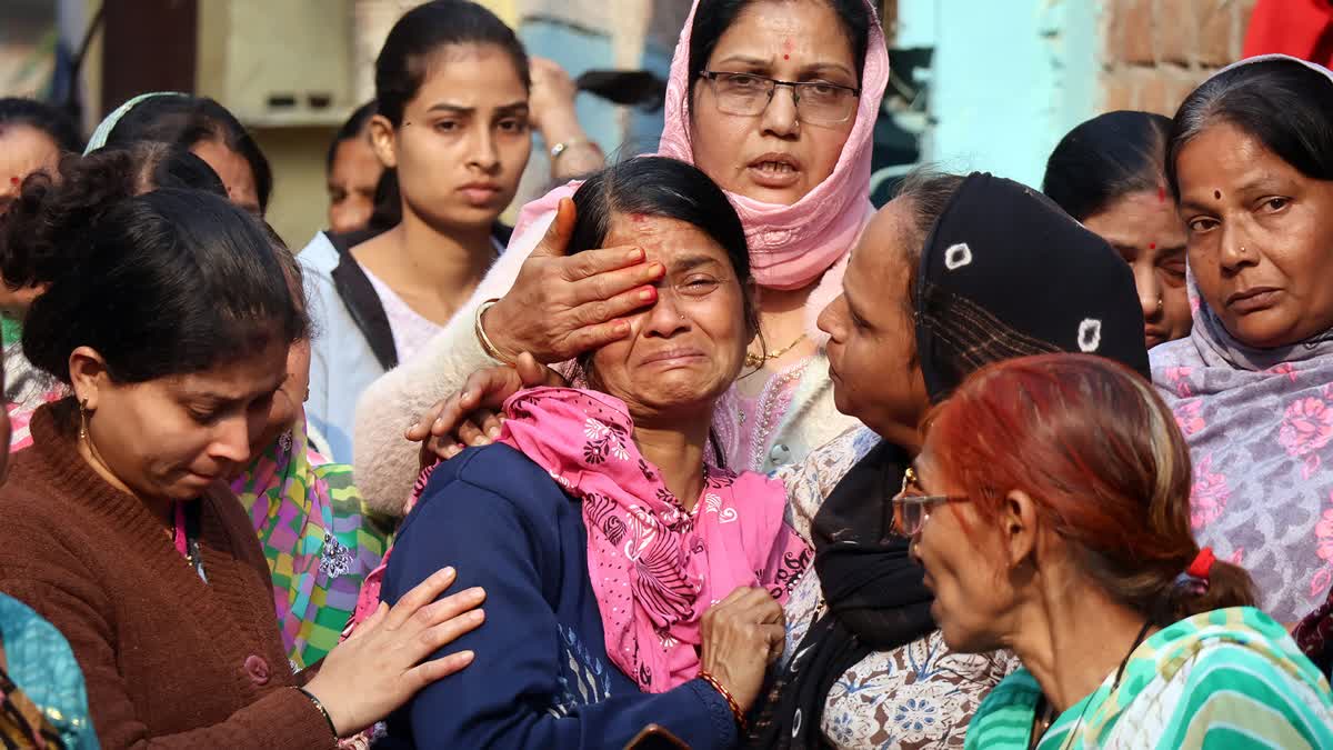 Family members mourn the death of a person who allegedly died after consuming contaminated water in the Bhagirathpura area of Indore