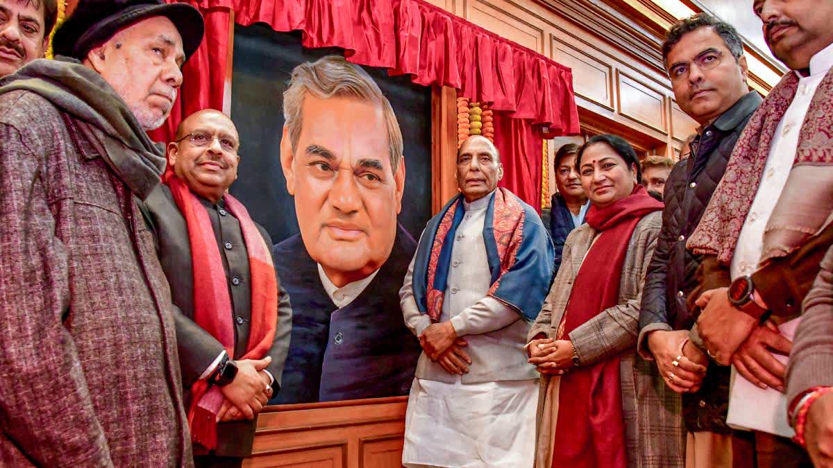 Rajnath Singh unveils the portrait of Atal Bihari Vajpayee at Delhi Assembly on Saturday.