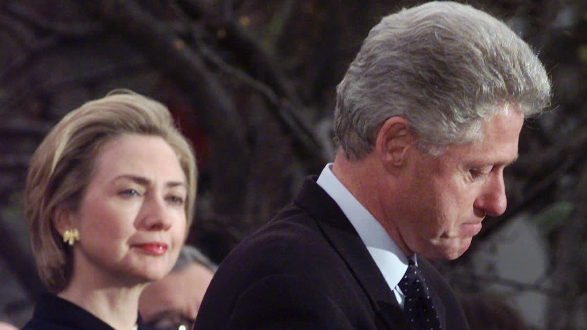 FILE - President Clinton makes a statement as first lady Hillary Clinton looks on at the White House, Dec. 19, 1998 in Washington.