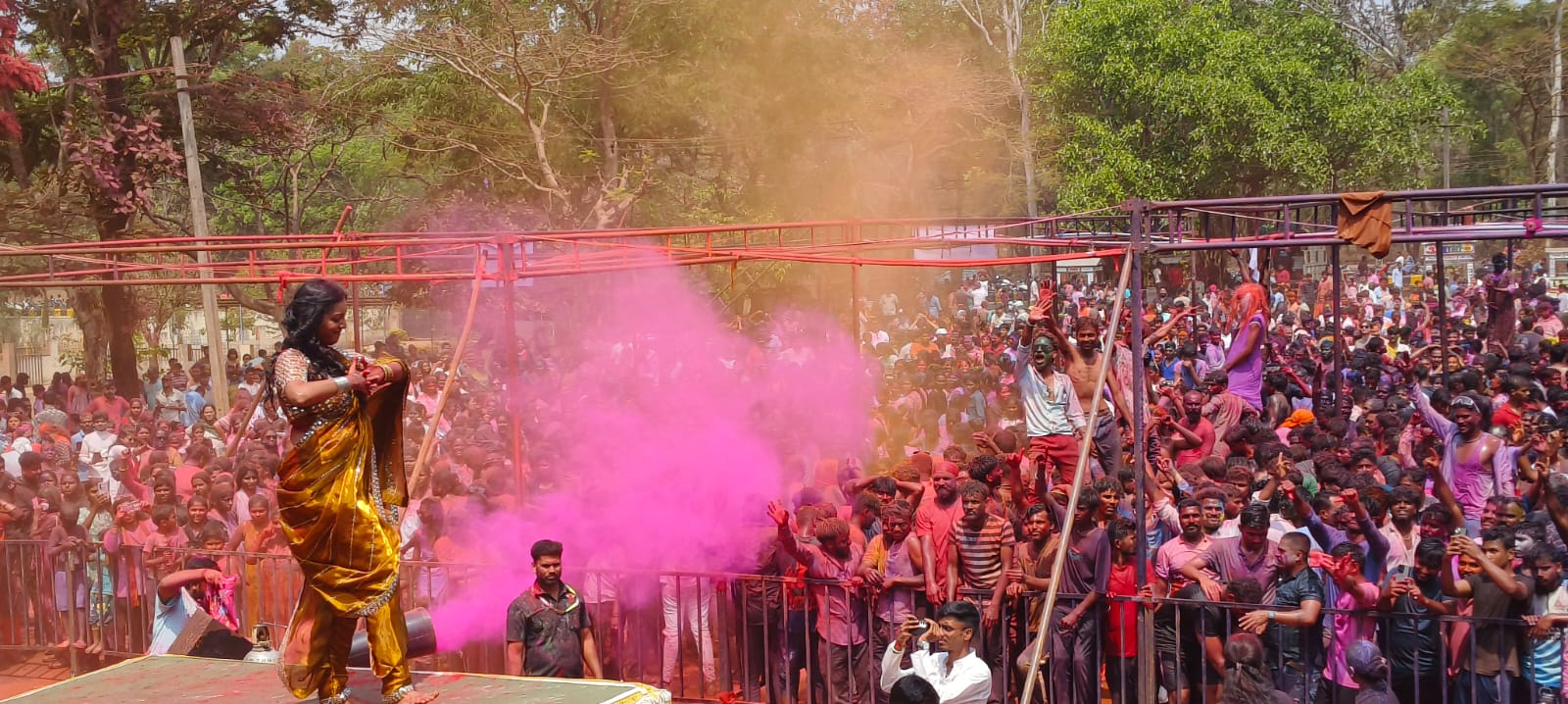 Holi Celebration In Belagavi: Young men and women dancing and having fun