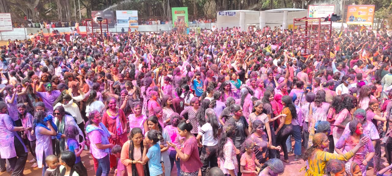 Holi Celebration In Belagavi: Young men and women dancing and having fun