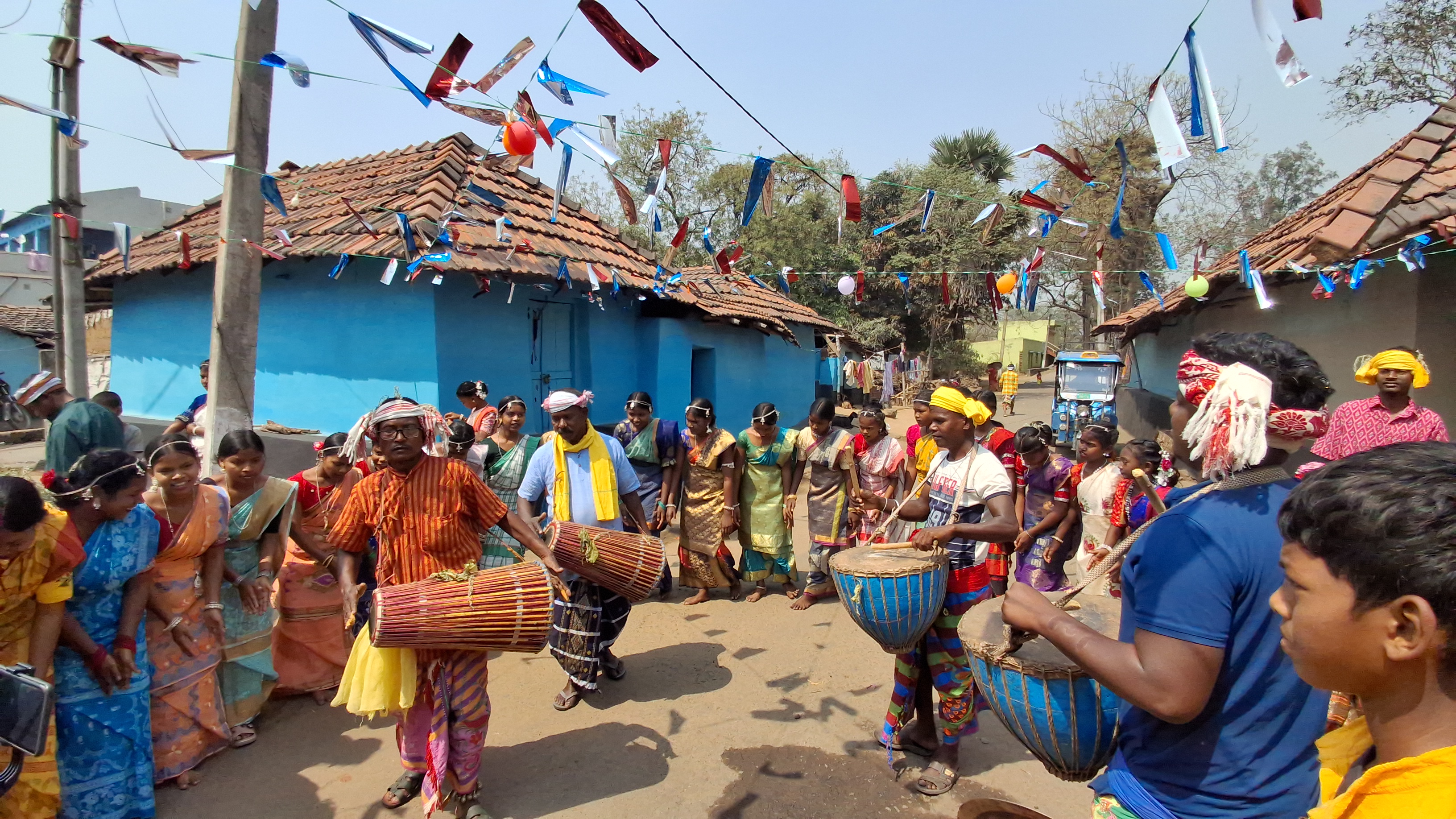 Male members of the tribal community play dhamsa madals during Baha