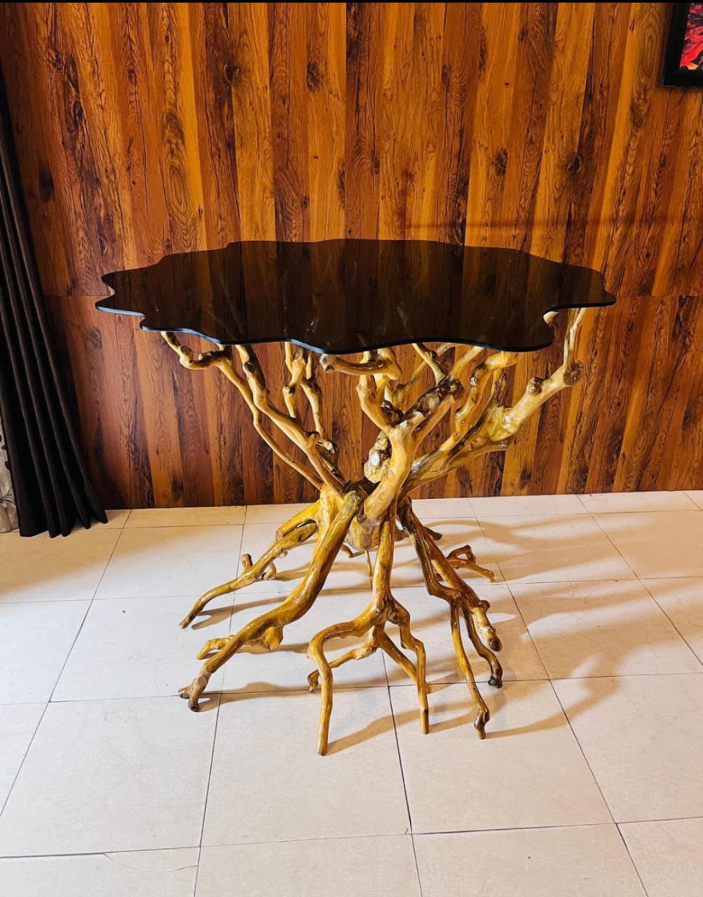 An artist has made various furniture from the trunk of a discarded tea tree in Dibrugarh