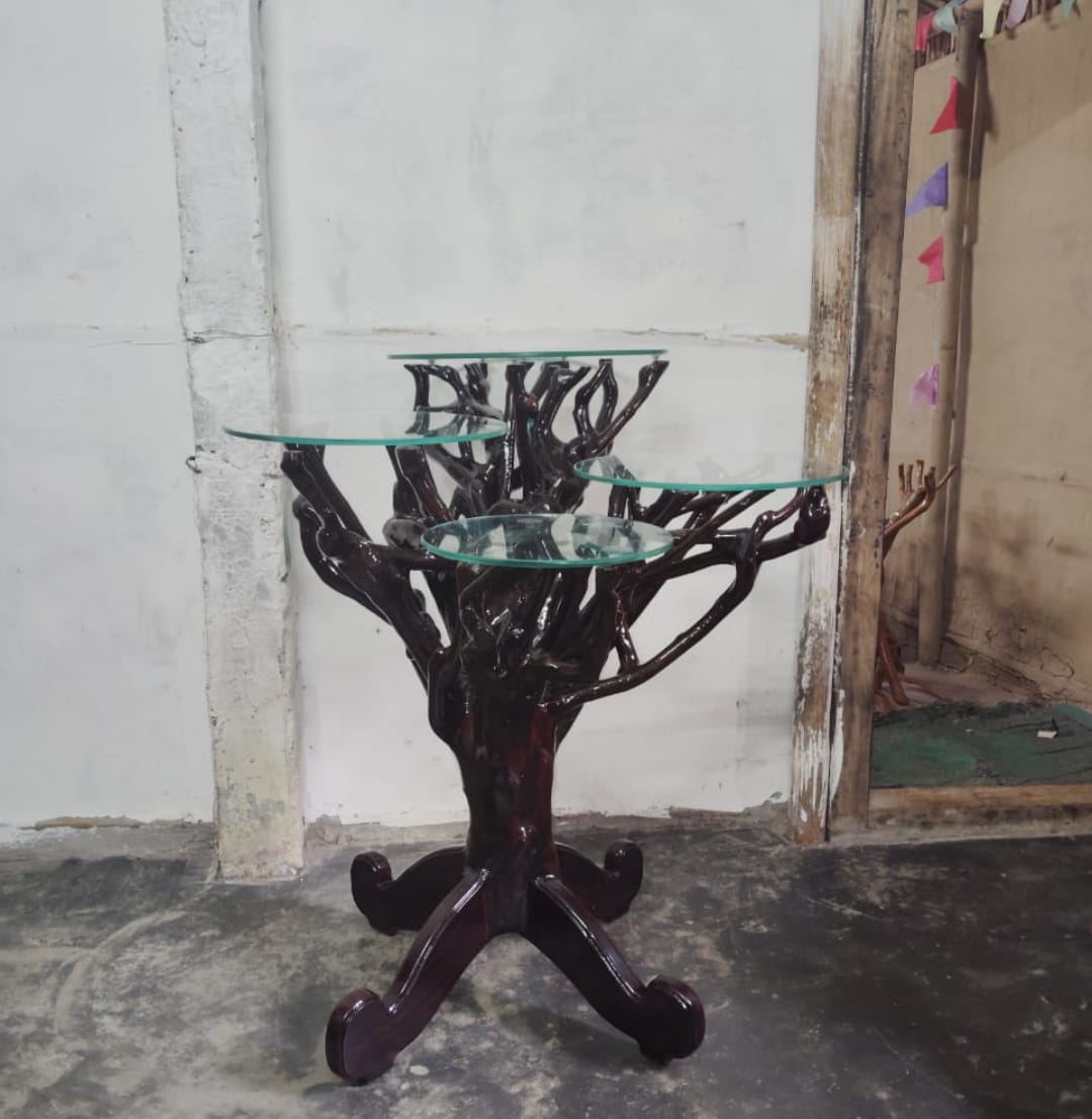 An artist has made various furniture from the trunk of a discarded tea tree in Dibrugarh