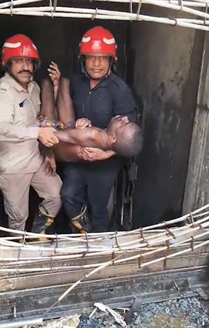 Emergency teams carry out rescue operations at the fire-hit hotel.