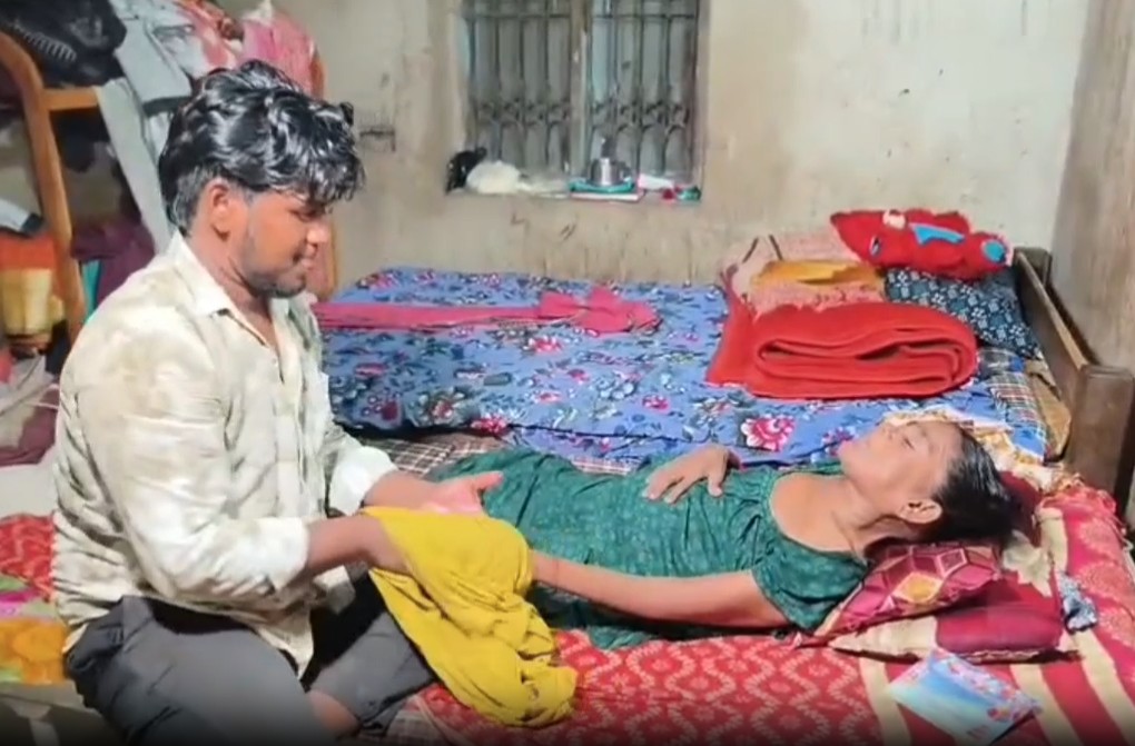 Son Satyajit Parida serving mother Padmabati Parida