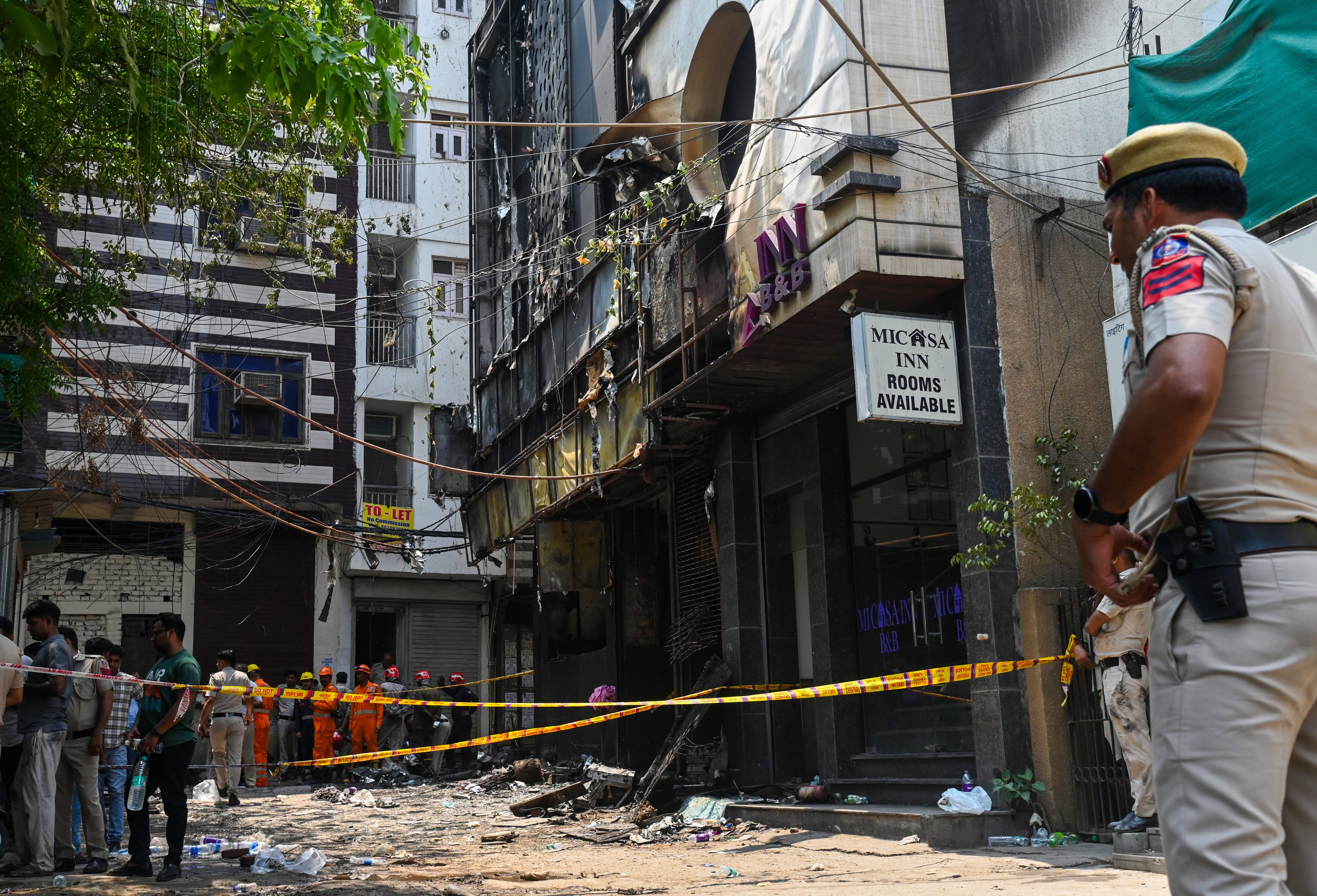 A police officer stands guard at the site.