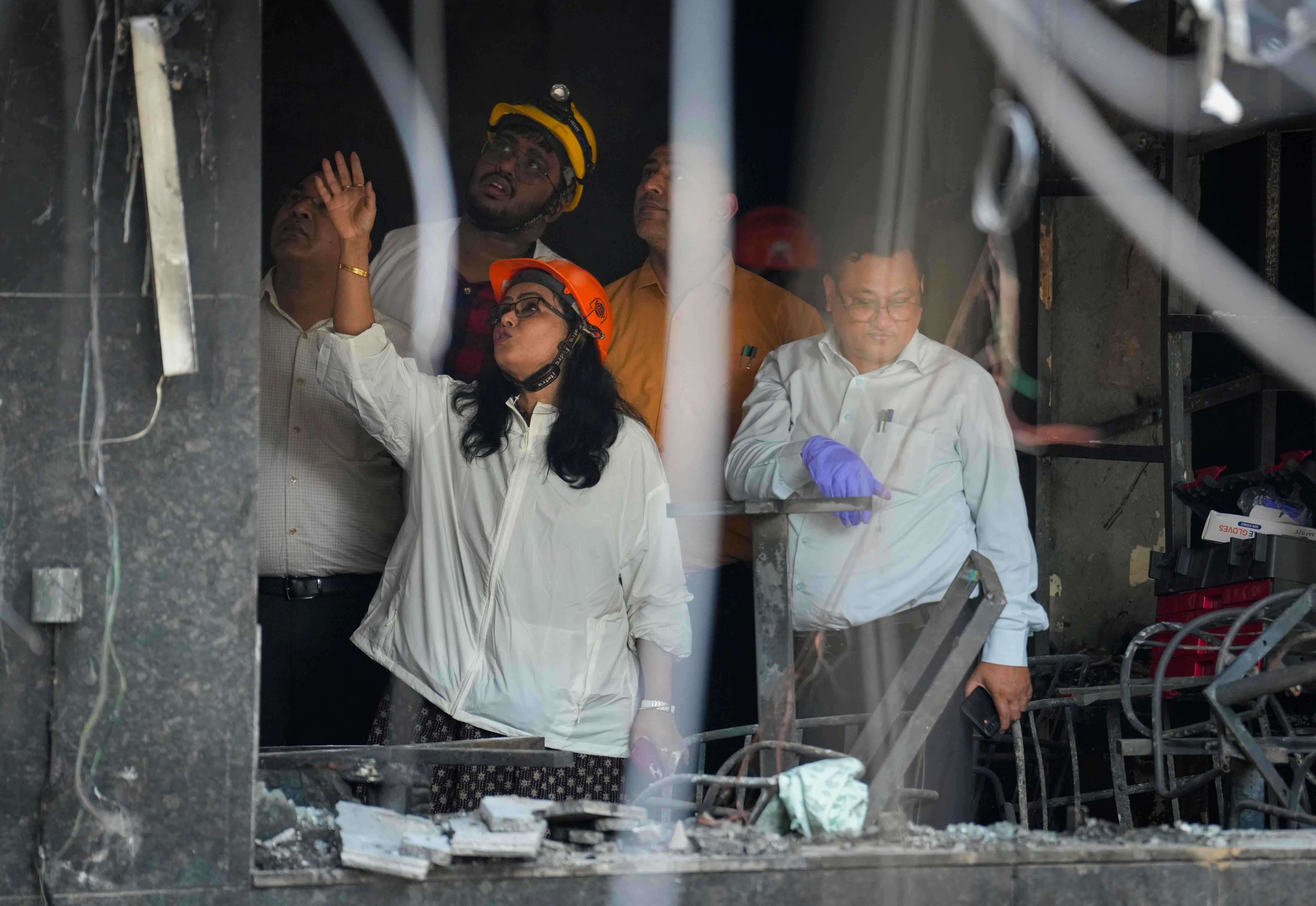 Forensic officials at the site after a fire broke out in Malviya Nagar.