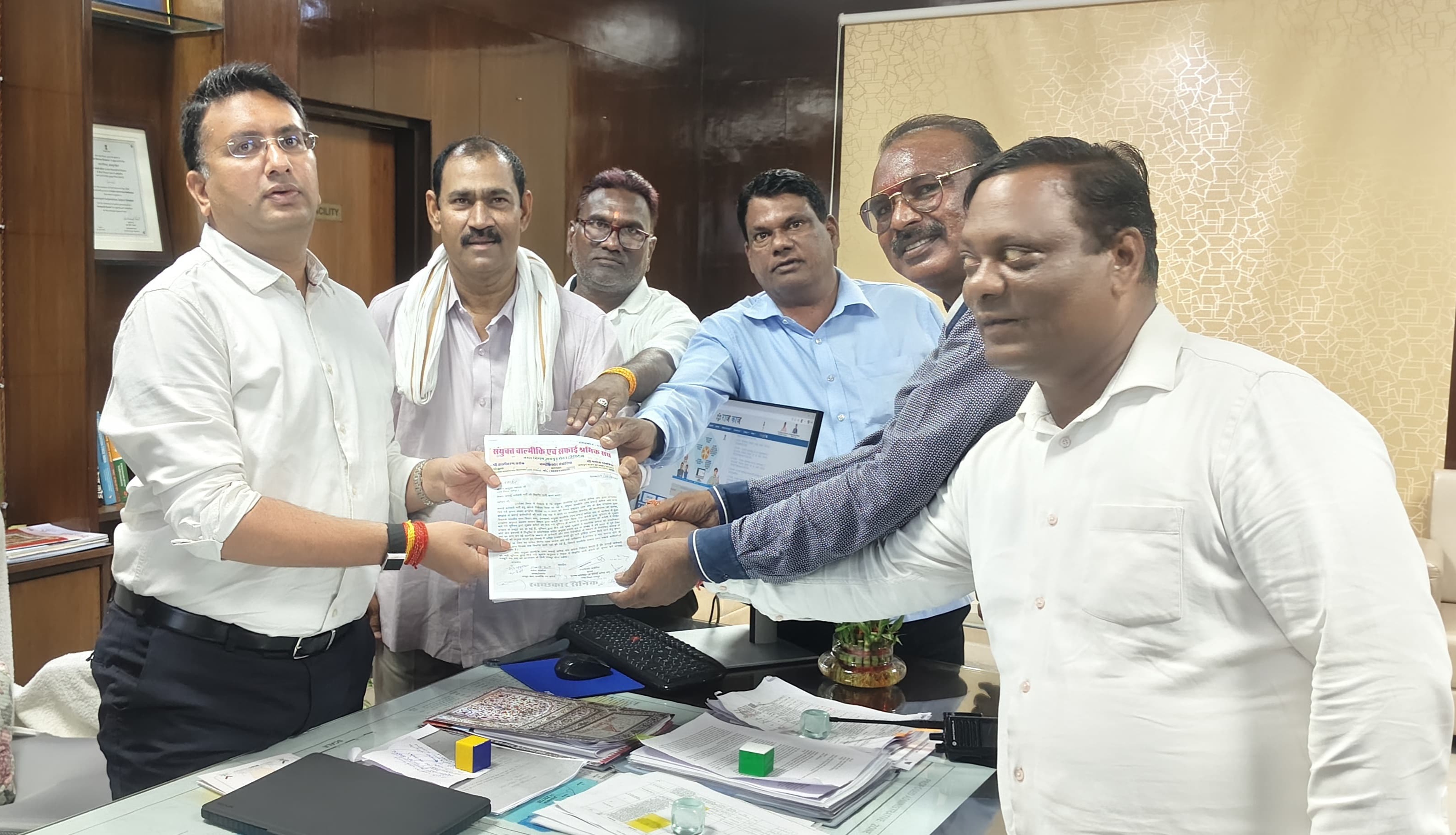 Office bearers of the Valmiki and Sanitation Workers' Union submitting a memorandum to the Municipal Commissioner.