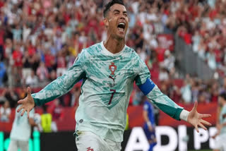 Portugal's Cristiano Ronaldo (7) celebrates after scoring their opening goal during the World Cup round of 32 soccer match between Portugal and Croatia in Toronto