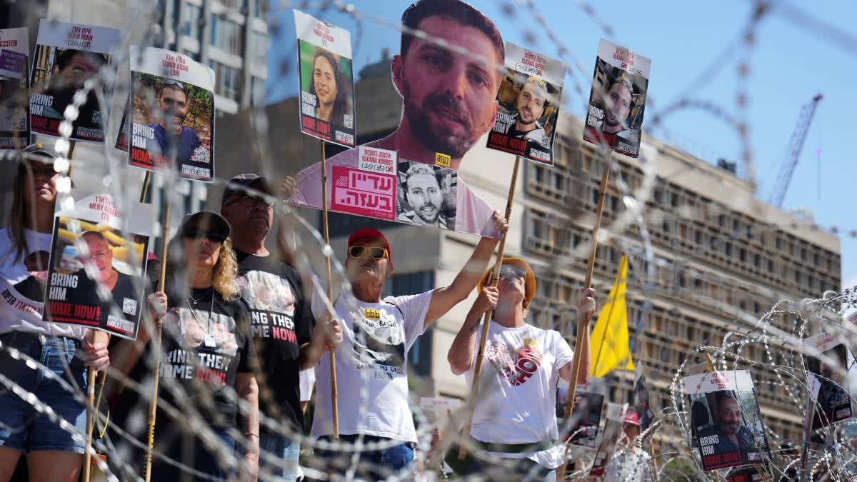 Israeli Fire Again Kills Gaza Aid Seekers As US Envoy Meets With Hostages Families Families of hostages protest, demanding the release from Hamas captivity in the Gaza Strip, at the plaza known as the hostages square in Tel Aviv, Israel, Saturday, Aug. 2, 2025.