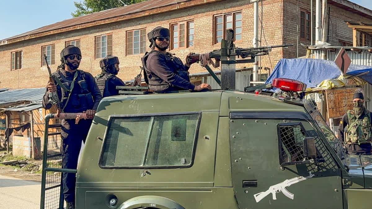 Security personnel keep a vigil amid an ongoing encounter between security forces and terrorists in a forest area at Akhal, in Kulgam district, Jammu and Kashmir, Sunday, Aug. 3, 2025.