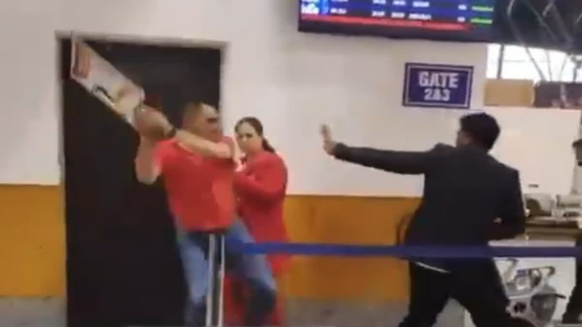 Screengrab shows the man attacking one of the staff members with a signboard